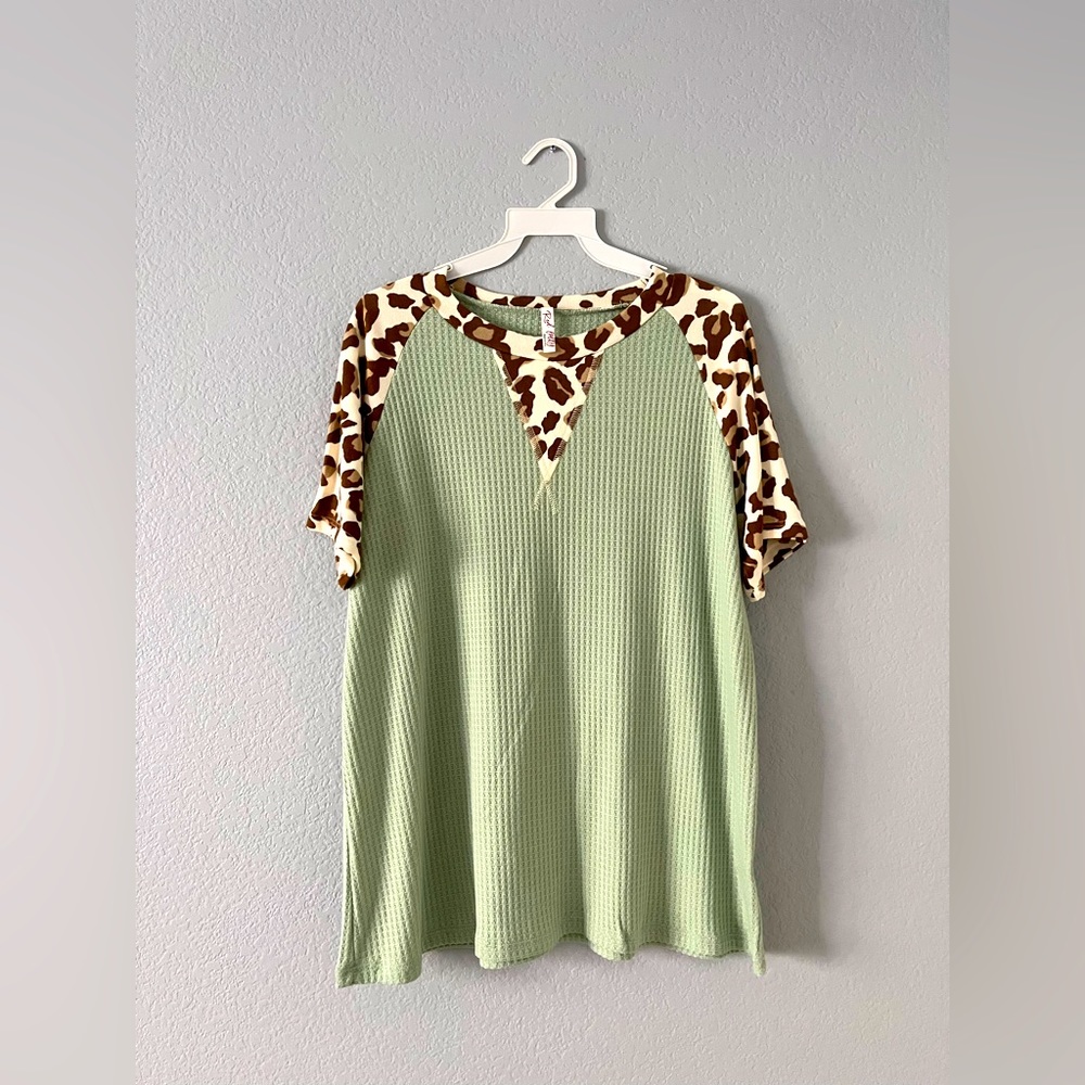 Green cheetah shirt. Available in sizes S, M and L.